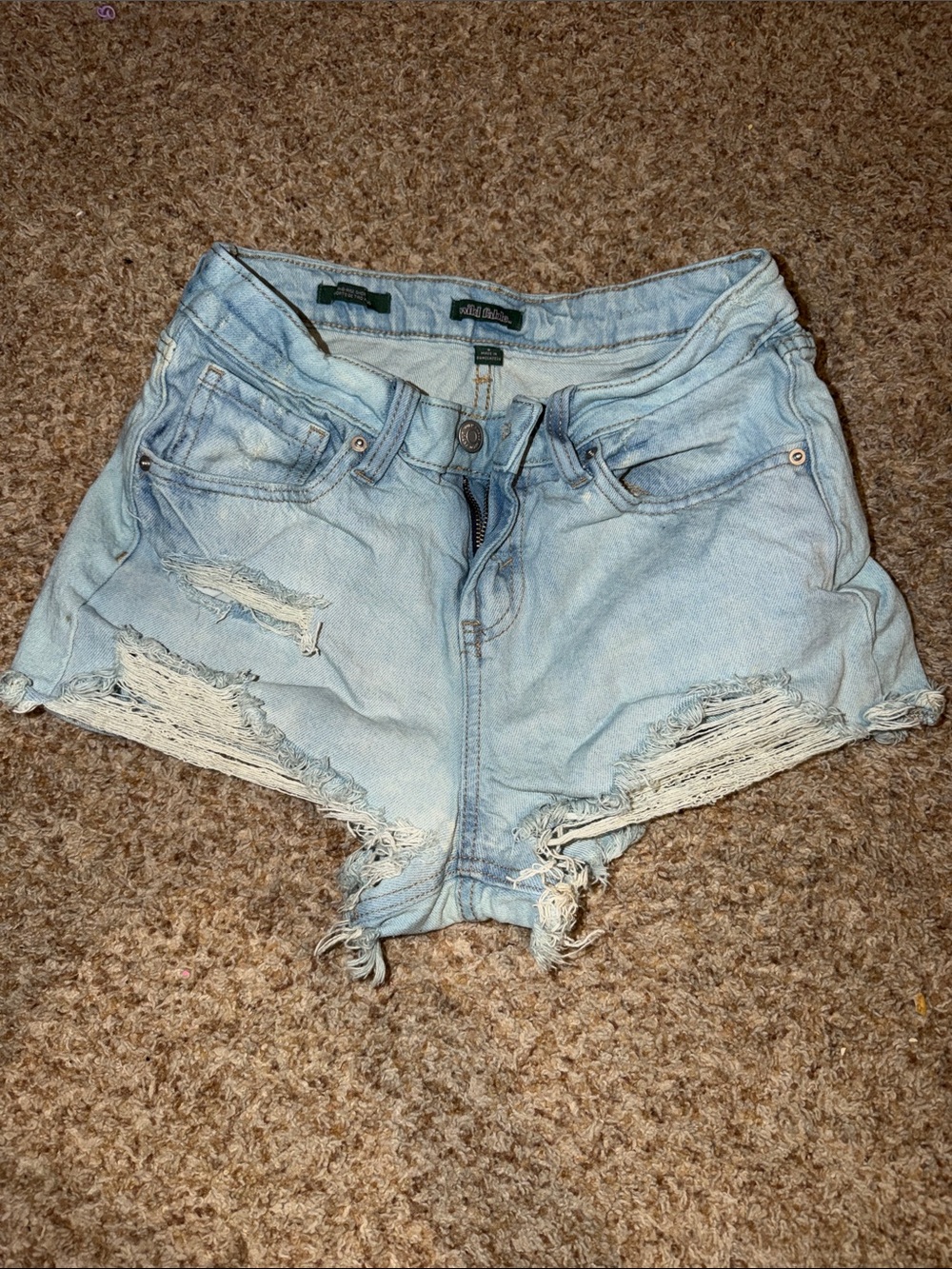 Wild Fable light wash denim shorts feature a distressed, frayed hem